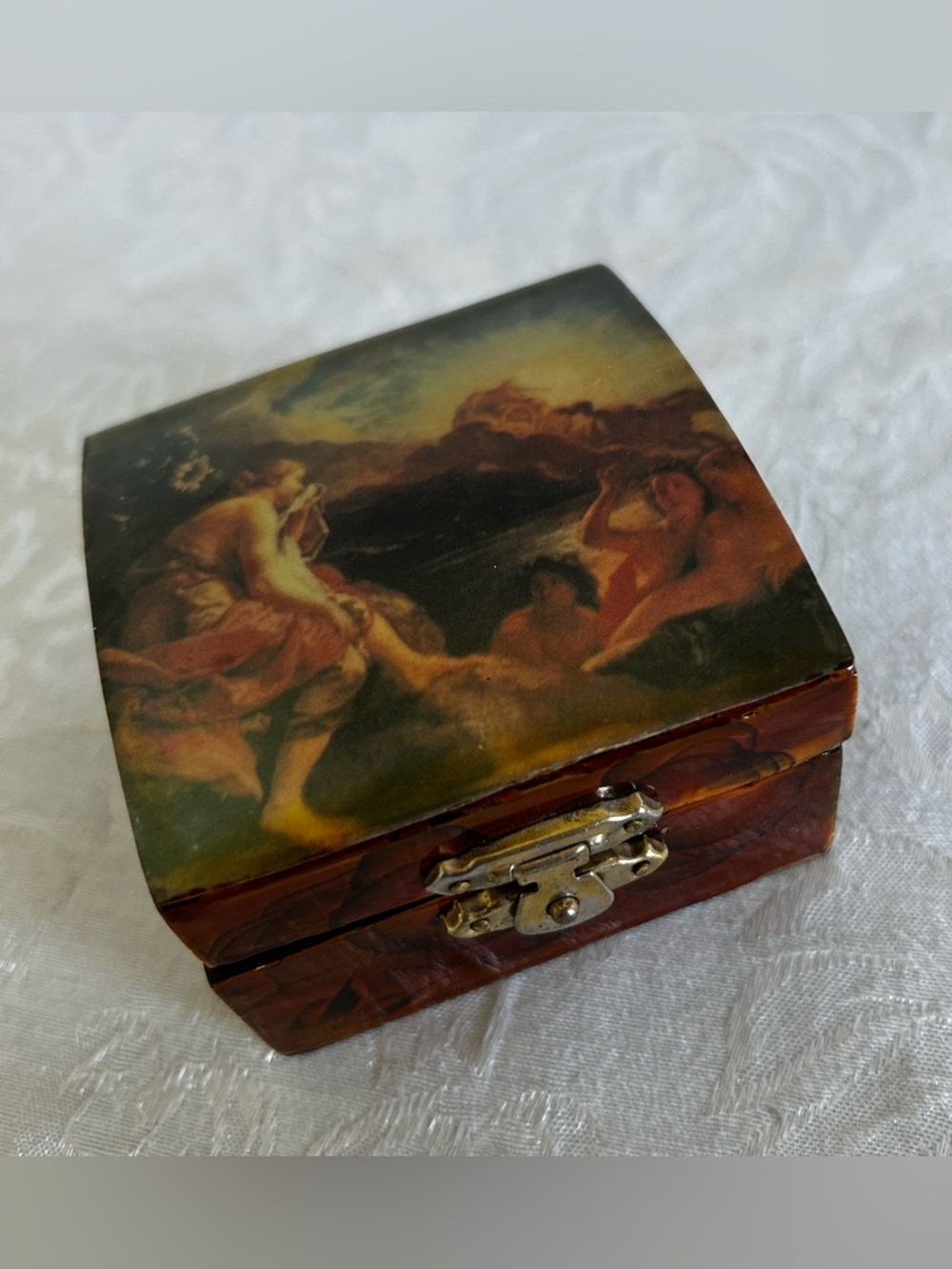 Decorative Vintage-Style Hinged Trinket Box in Brown and Gold Tones.